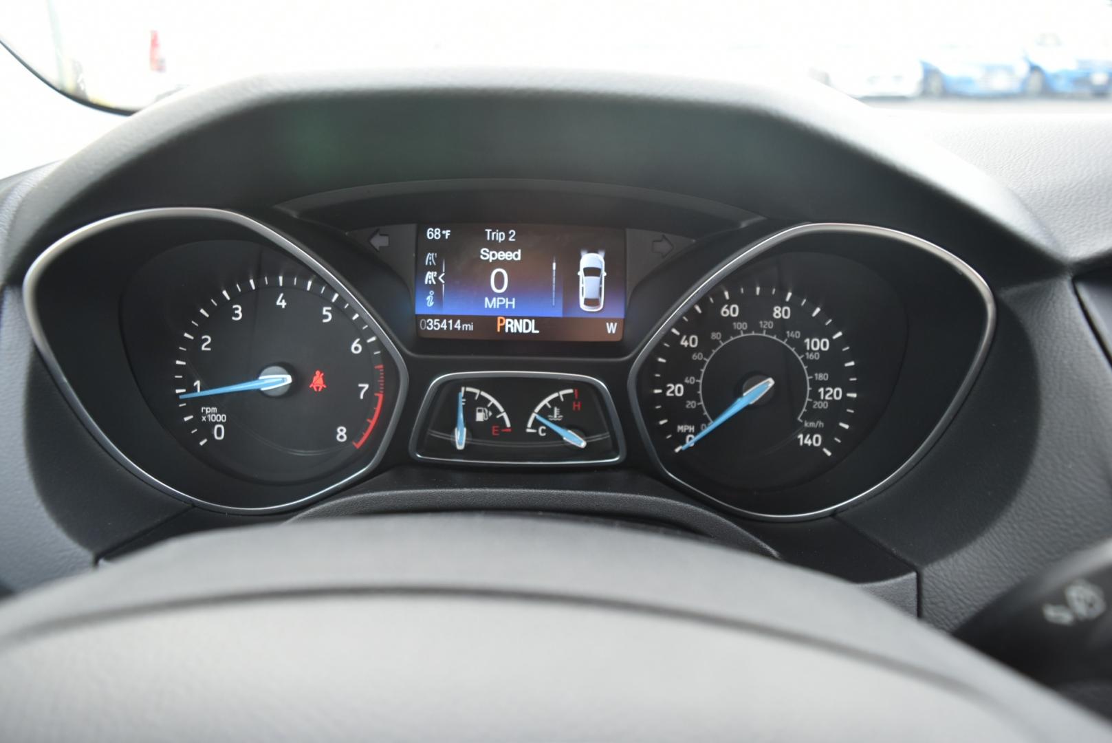 2016 Gray /Black Ford Focus SE (1FADP3F26GL) with an 2.0L I-4 GDI TI-VCT FLEX FUEL engine, 6-Speed Powershift Automatic transmission, located at 1600 E Hwy 44, Rapid City, SD, 57703, (605) 716-7878, 44.070232, -103.171410 - Photo#16